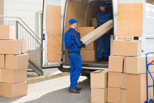 Local movers handling a residential relocation in a French city apartment