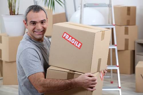 Moving van and packed boxes for a French home removal