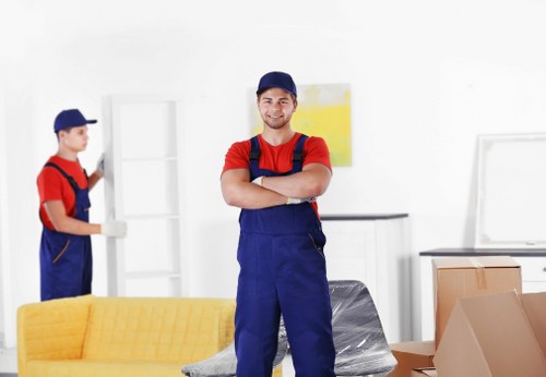 Office furniture being carefully moved during a local relocation