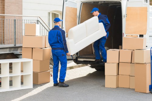 Moving crew loading household items for a French home move
