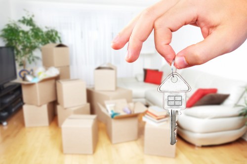 Packed moving boxes and furniture for a local house relocation