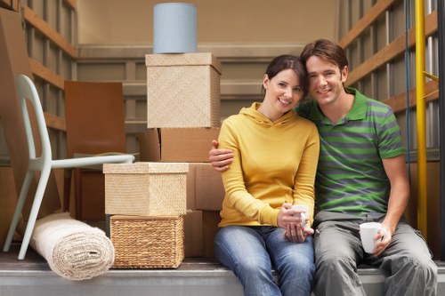 Professional removals team working carefully with insured safety procedures