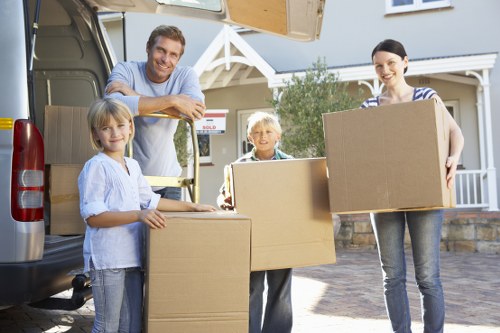 Packed moving boxes and furniture prepared for transport in France