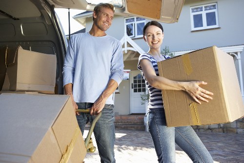 Movers handling household items during a cross-border relocation