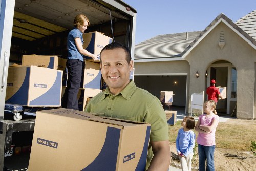 Packed office boxes and workstations prepared for relocation in France