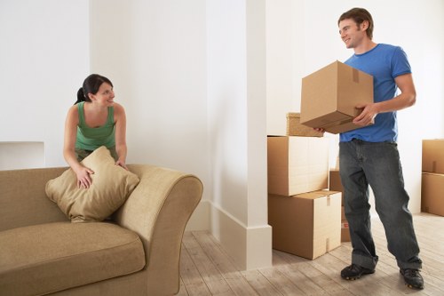 Removal helpers unloading household items at a new French property